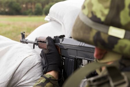 soldier in a camouflage suit fightsの写真素材