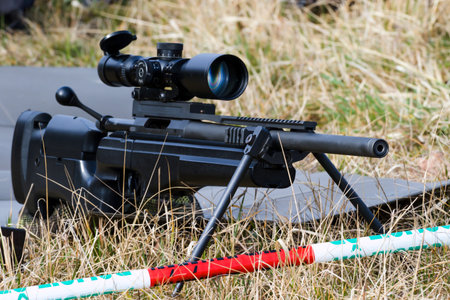 Military sniper aims at a target