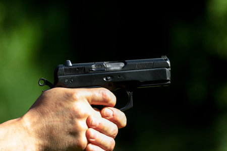 Man practicing shooting with a gunの写真素材