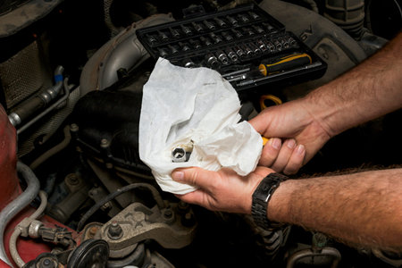 The mechanic fixes the vehicle's engine
