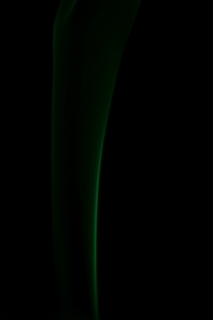 colored smoke on a black backgroundの写真素材