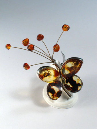 Butterfly made of silver and amberの写真素材