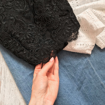 Black lace top closeup on a wooden backgroundの写真素材