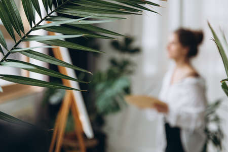 Blur background of artist painting with brush on canvasの写真素材