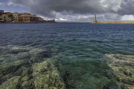 The bay of  Chania with rocks and lighthouse, Crete, Greeceの写真素材