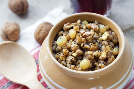 Kutia - sweet grain pudding, the traditional first dish of Christmas Eve supper served in Eastern...