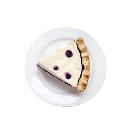 Piece of cheesecake with blueberries on a plate isolated on white background with clipping pathの写真素材