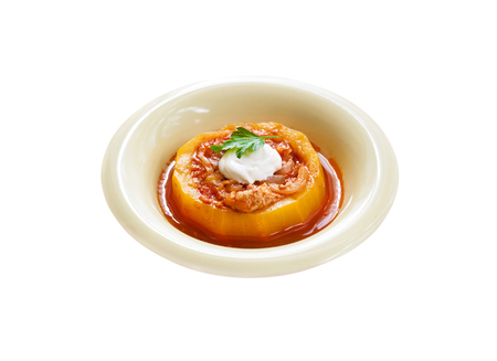 Zucchini stuffed with meat and vegetables, stewed in tomato sauce isolated on white background with clipping pathの写真素材