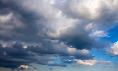 Beautiful dark stormy clouds on a blue sky before a thunderstorm