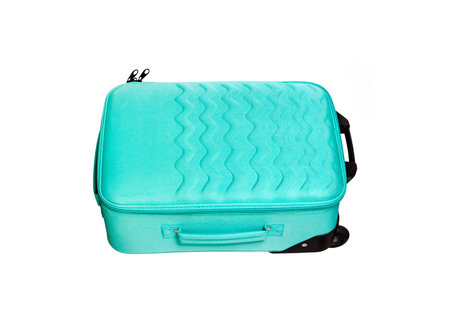 Bright turquoise textile travel suitcase with wavy pattern isolated on white background with clipping pathの写真素材