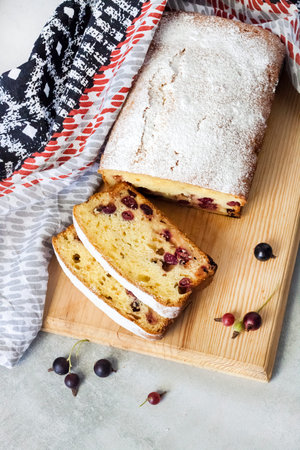 Jostaberry sponge cake on wooden cutting board
