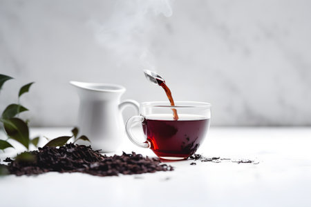 Cup of freshly brewed black tea and dry black tea on white background with copy space. AI generated.の素材