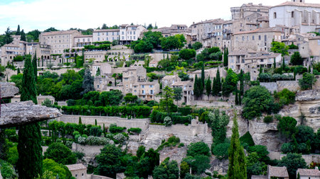 Beautiful city of Gordes perched atop a hillside in the Provence countryside of Franceの写真素材