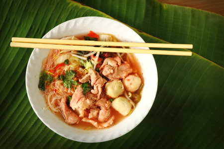 Thai noodle in dish with banana leaf background.の写真素材
