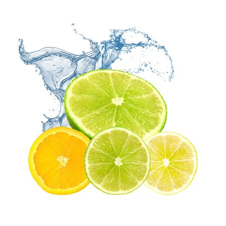 Limes, orange and lemon in water splashの写真素材