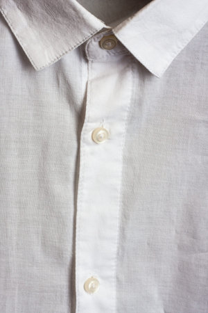White shirt close up. Collar and buttons