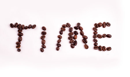 Text made of coffee beans: COFFEE. Texture of the coffee beans on a white background. Smelly,...
