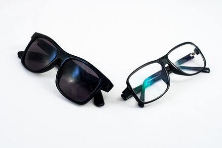 Two pairs of glasses: sunglasses and corrective eye glassesの写真素材
