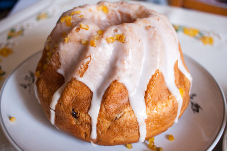 Detail of delicious sweet Easter cake covered with white frosting