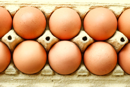 Chicken brown eggs in paper box close up