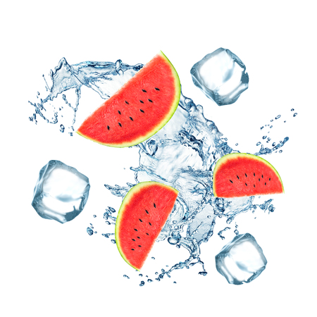 Fresh watermelon fruits falling in water with splash and ice cubes on white background.の写真素材