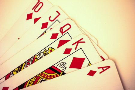 Playing cards close up detail. Black and red cards with a little bit sepia fiter