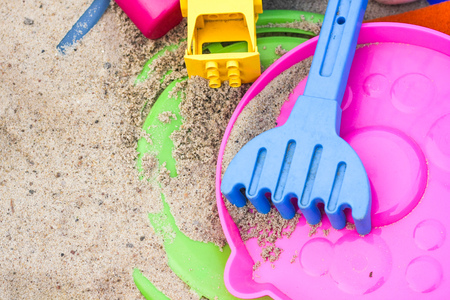 Colorful toys in the sandbox. Happy childhood, way to spend time.の写真素材