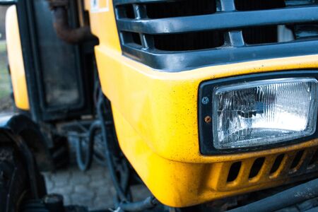 Detail of a yellow car: front light close up detailの写真素材