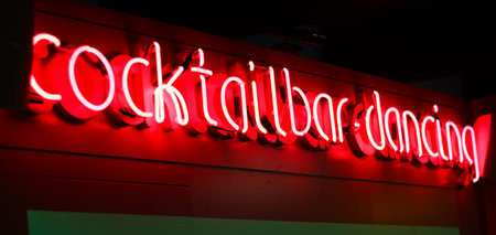 Red nylon light text in a club or bar: Cocktail bar, dancingの写真素材