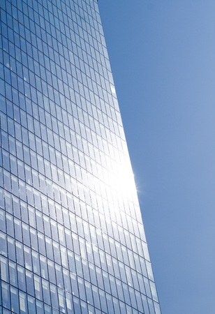 Business buildings detail - architecture with sky reflection backgroundの写真素材