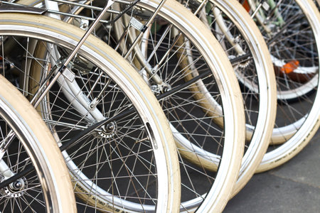 WARSAW, POLAND, 4 April 2017: Row of brand new white bicycles with white wheels close up