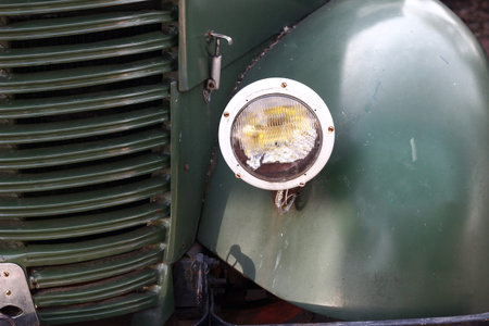 POLAND, OTREBUSY, 31 March 2017: old green car close up lightsのeditorial素材