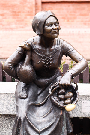 POLAND, TORUN, 17 February 2017: Statue of a market woman with eggs in the basket.のeditorial素材