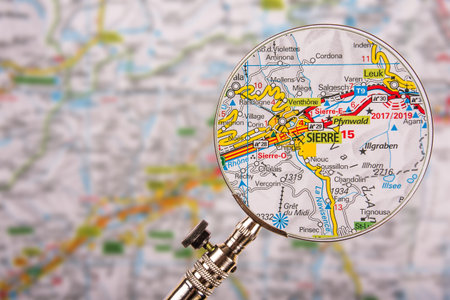Map of Sierre Siders with magnifying glass on table