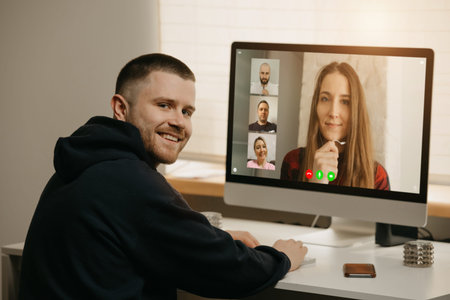 Remote work of a man on the desktop computer