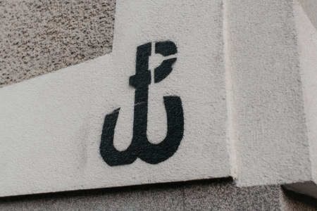 Warsaw, Poland - March 19, 2022: graffiti of the Warsaw Uprising Crossのeditorial素材