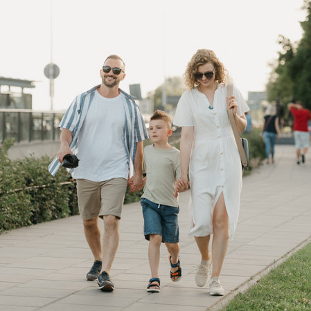 Father, mother and son are having fun in an old European town. Happy familyの写真素材