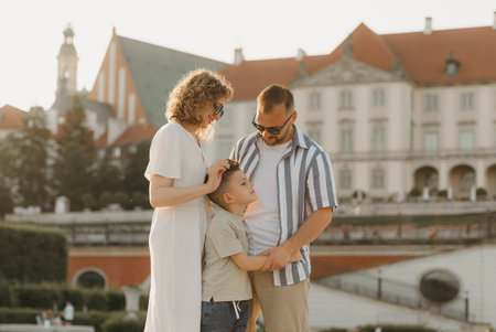 Father, mother and son are having fun in an old European town. Happy familyの写真素材