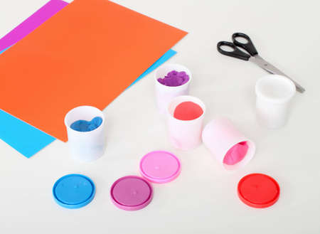 Pains, paintbrush, scissorson laying on tableの写真素材