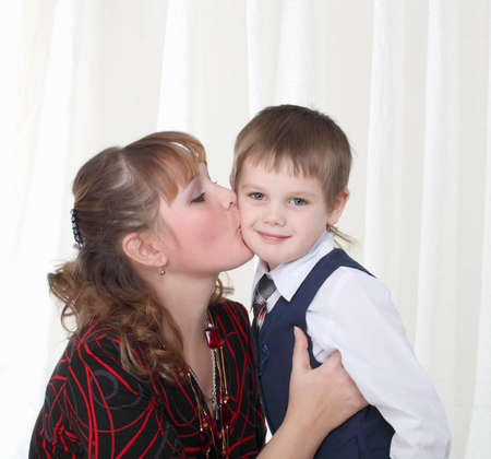 Little son kissing his motherの写真素材