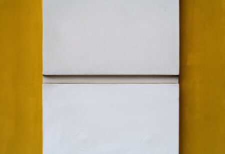 White column on yellow backgroundの写真素材