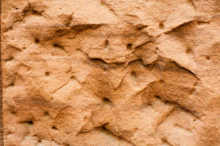 Stone wall painted light orange, background, texture.の写真素材
