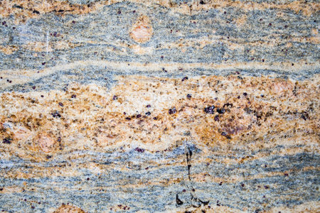 Decorative grainy gray-brown marble. Background, texture, geology.