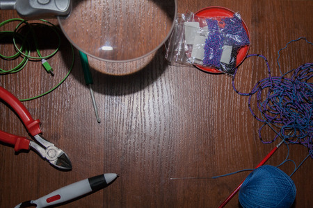 tailoring tools on brown wooden table. background, border.の写真素材