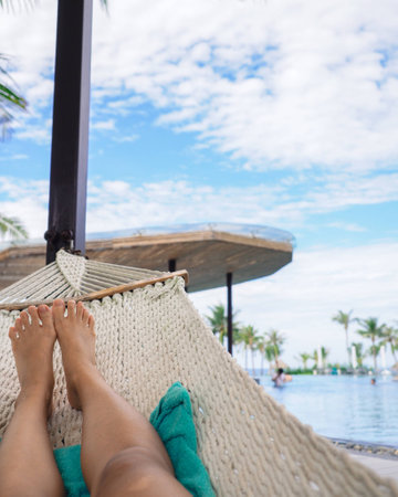 Chilling on a hammock by the poolの写真素材