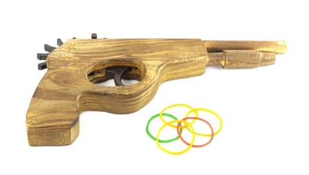 Wooden Catapult Gun with rubber on white backgroundの写真素材