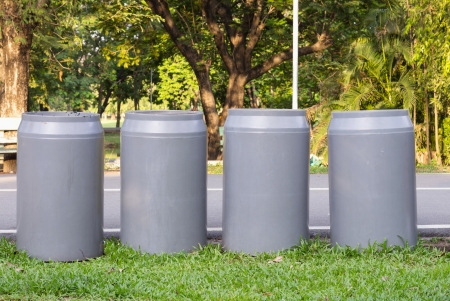 four recycle bins in the park の写真素材