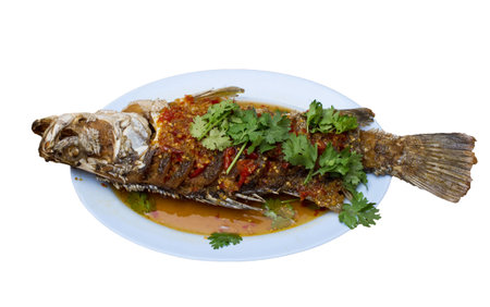 Fried snapper with chili sauce on the plate with white background