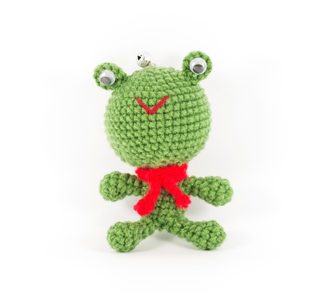 handmade crochet green frog doll on white backgroundの写真素材