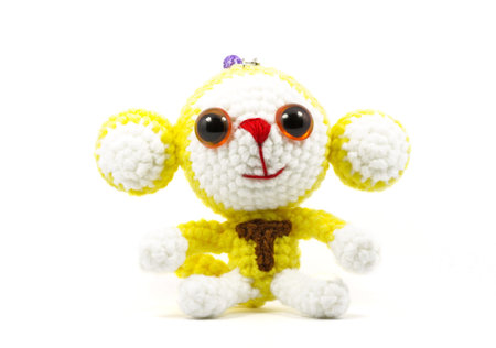 handmade crochet monkey doll on white backgroundの写真素材